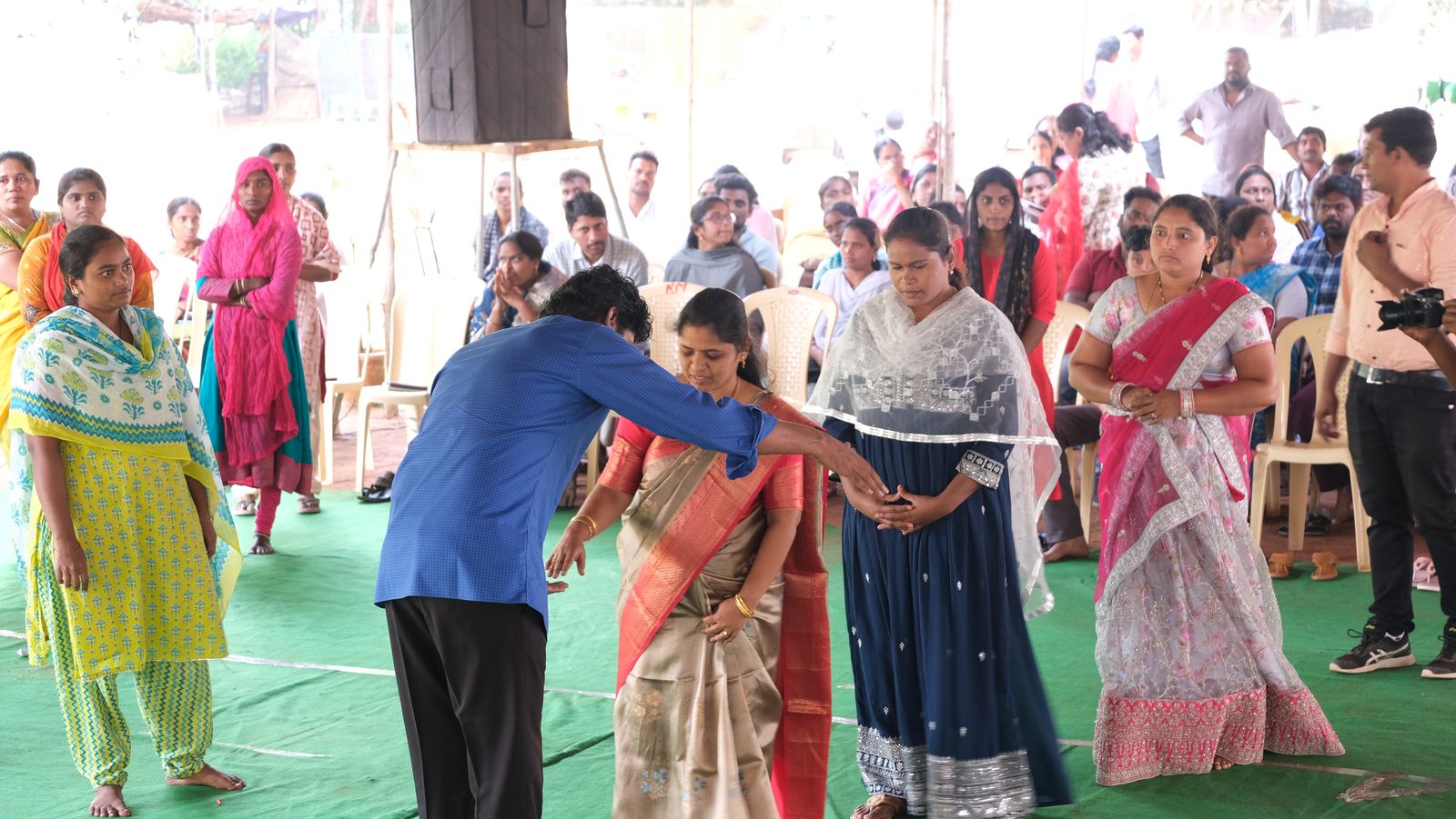 Bro. Smiles laying hands and praying for healing