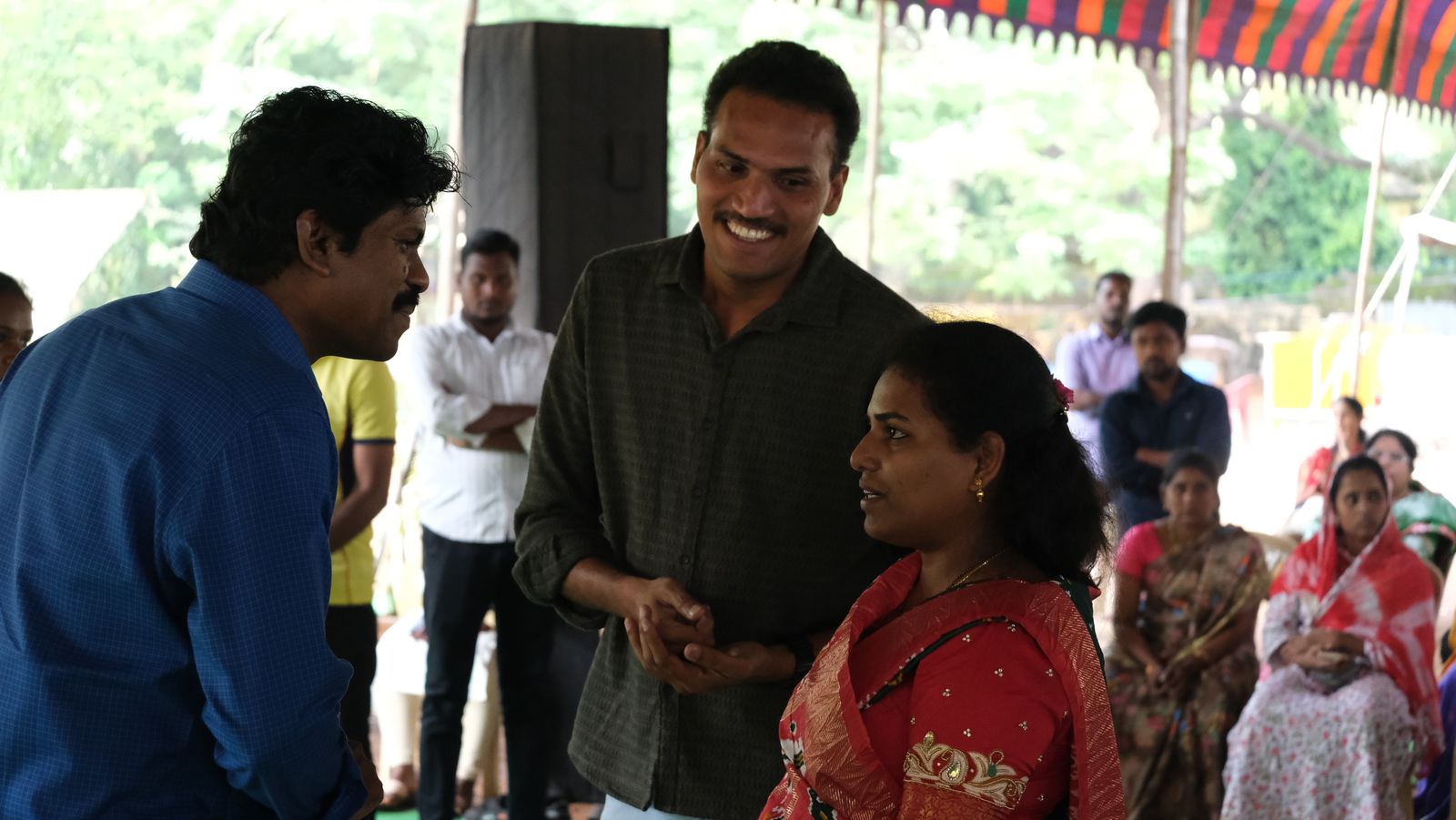 Bro. Smiles ministering and praying with people
